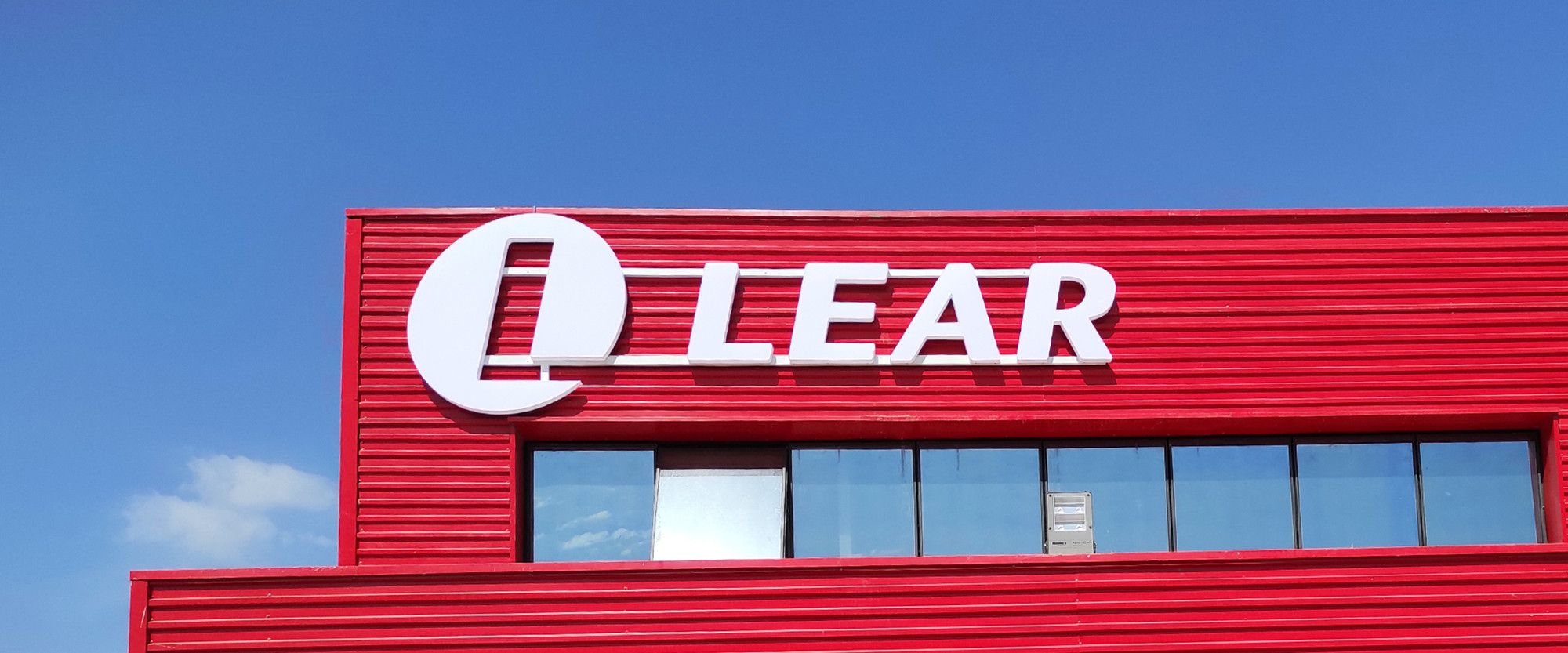 Company sign installation for Lear Corporation on one of its 12 new site acquistions.